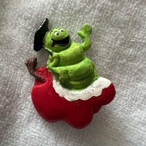Apple pin with worm